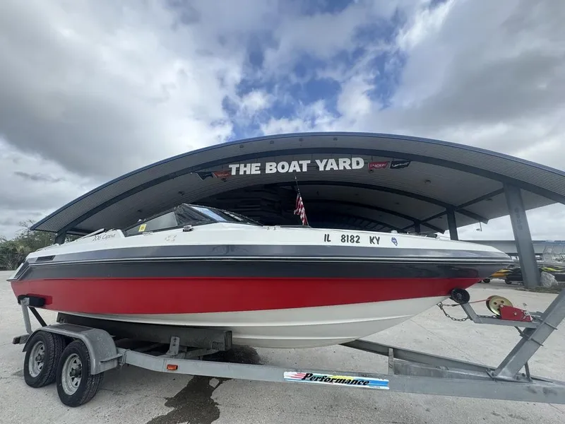 Slide: The Image of 1990 Rinker 206 Captiva Cuddy boat on trailer at The Boat Yard. - 4