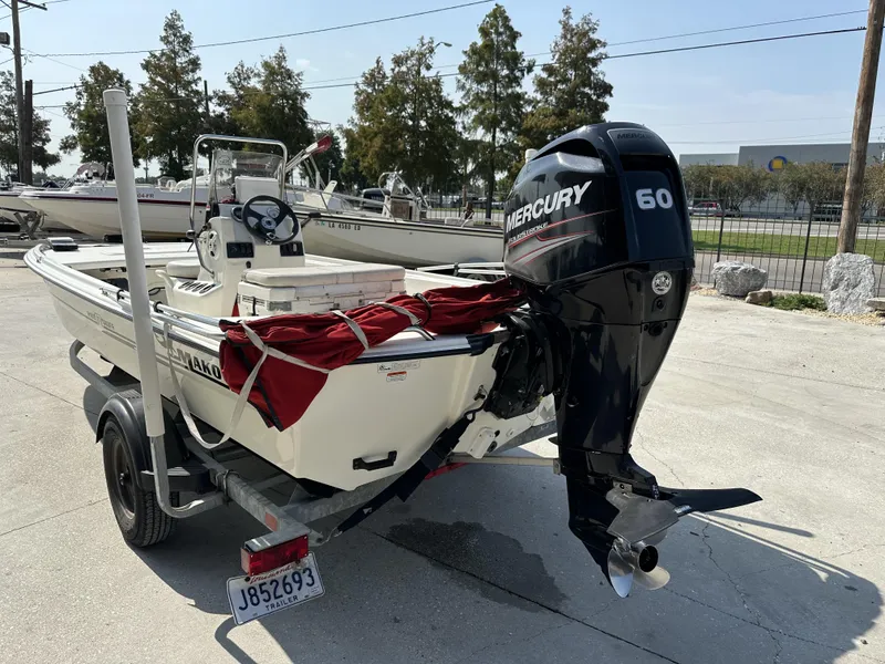 Slide: The Image of 2018 Mako 17 Pro Skiff with Mercury 60 engine on trailer. - 3