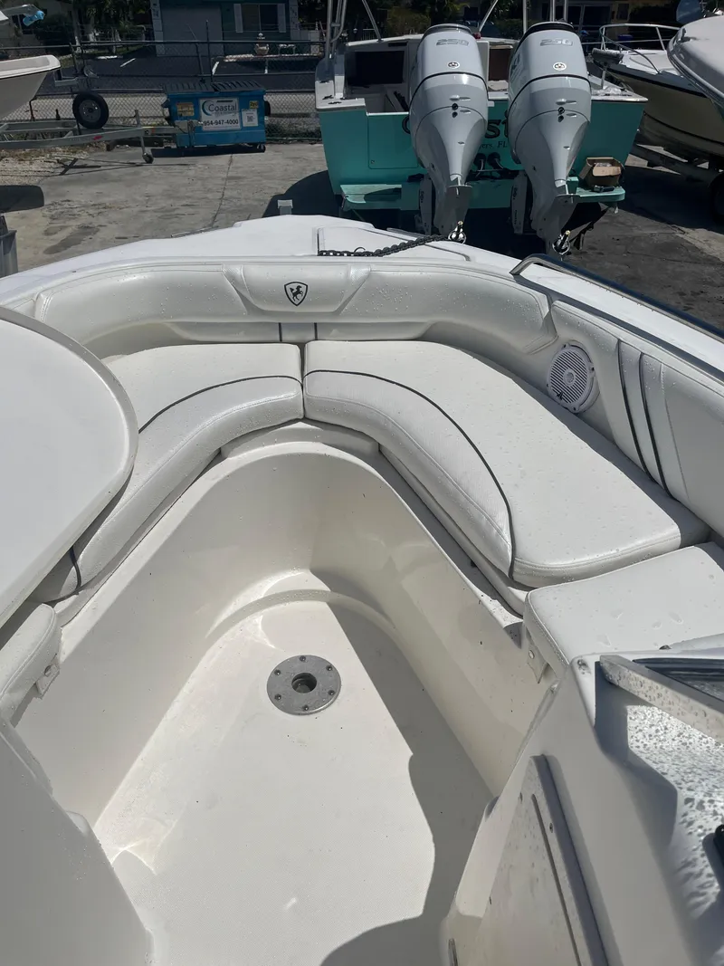 Slide: The Image of 2008 Century 2350 Dual Console boat with white seating and twin engines. - 16