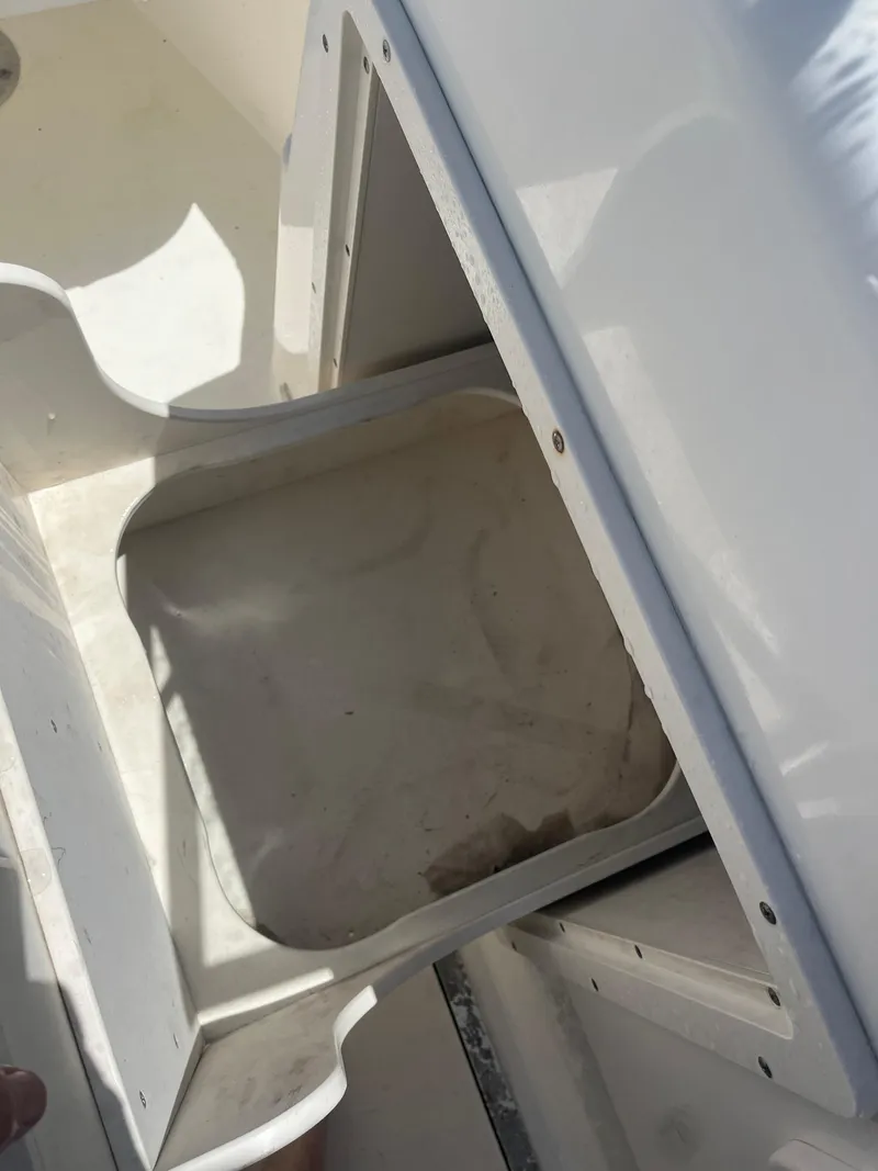 Slide: The Image of 2008 Century 2350 Dual Console boat storage compartment, open and empty. - 21