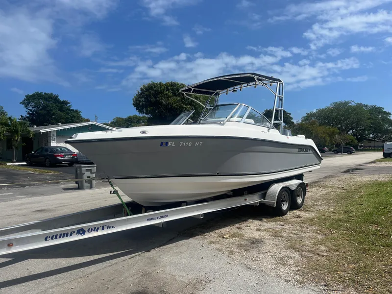 Slide: The Image of 2008 Century 2350 Dual Console boat on trailer, parked outdoors under blue sky. - 7