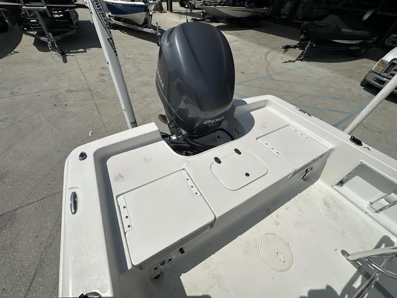 Slide: The Image of 2012 Sea Hunt BX 22 Pro boat with Yamaha 200 engine, docked outdoors. - 8