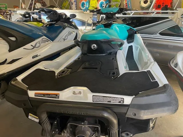 Slide: The Image of 2021 Sea-Doo GTX Pro jet ski in showroom, featuring sleek design and vibrant colors. - 5