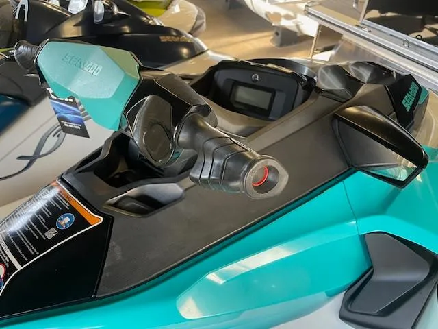 Slide: The Image of 2021 Sea-Doo GTX Pro jet ski, teal and black, close-up of handlebars and dashboard. - 6