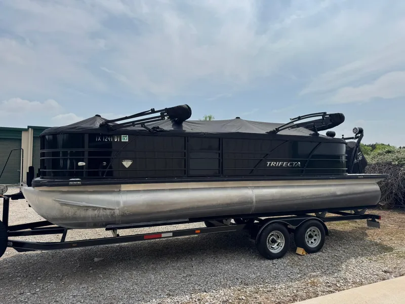 Slide: The Image of 2017 Trifecta SS 23RF pontoon boat on trailer, parked outdoors. - 11