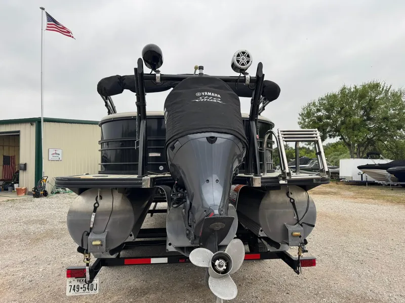 Slide: The Image of 2017 Trifecta SS 23RF pontoon boat with Yamaha motor, parked outdoors. - 3