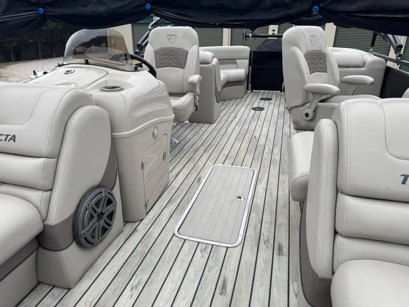 Slide: The Image of Luxurious 2017 Trifecta SS 23RF pontoon boat interior with plush seating and sleek design. - 4