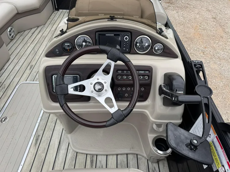 Slide: The Image of 2017 Trifecta SS 23RF boat dashboard with steering wheel and control panel. - 6