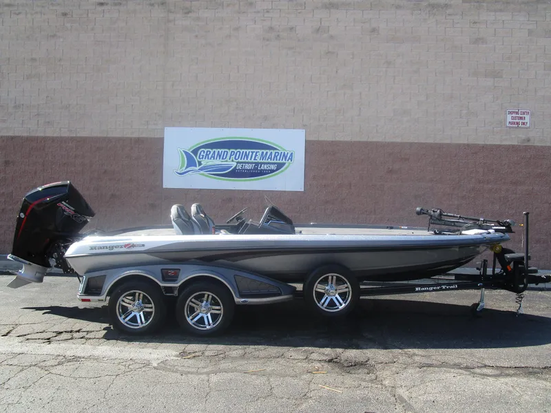 The Image of 2024 Ranger Z521R boat at Grand Pointe Marina, side view with trailer. - 0