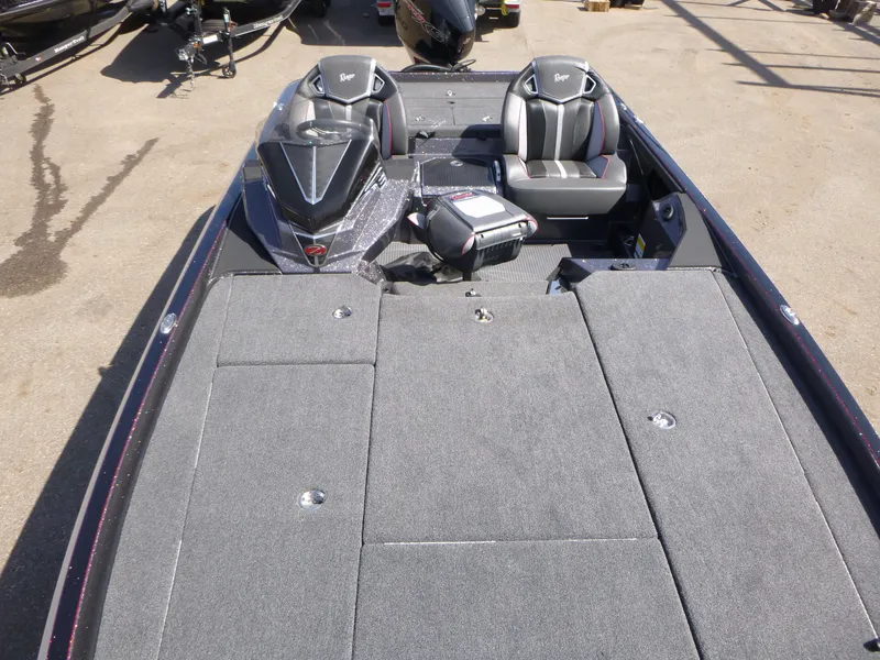 Slide: The Image of 2024 Ranger Z521R boat interior with gray seating and spacious deck layout. - 11