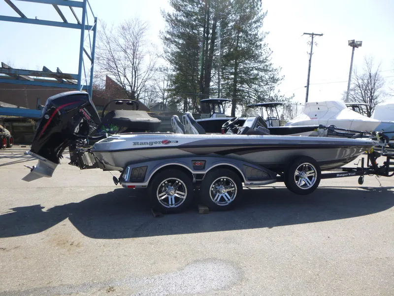 Slide: The Image of 2024 Ranger Z521R boat with trailer, parked outdoors, featuring sleek design and modern features. - 6