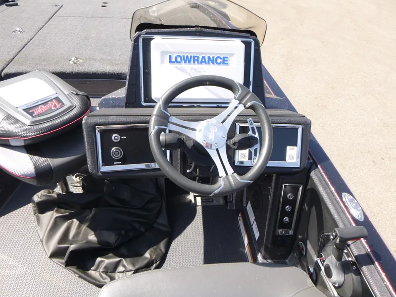 Slide: The Image of 2024 Ranger Z521R boat dashboard with Lowrance display and steering wheel. - 9