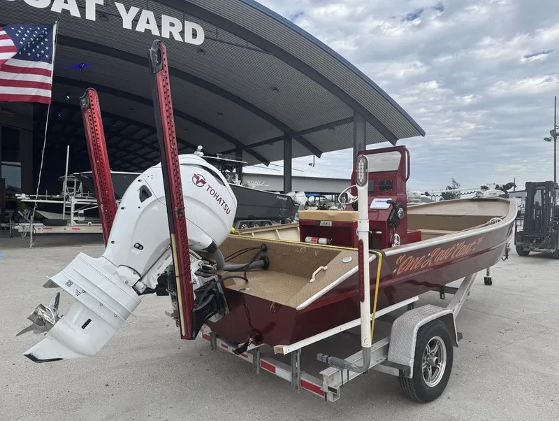 Slide: The Image of 2023 Custom Alumafab 20 CC boat with Tohatsu engine at a boat yard. - 10