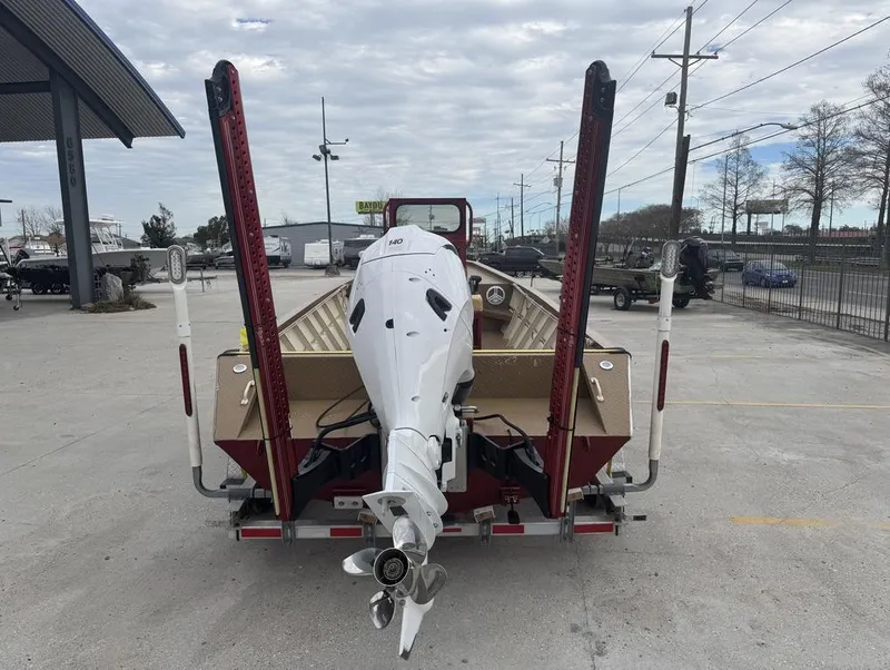 Slide: The Image of 2023 Custom Alumafab 20 CC boat with outboard motor, parked in a lot. - 11