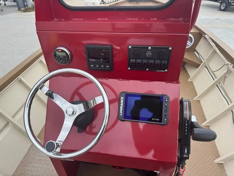Slide: The Image of 2023 Custom Alumafab 20 CC boat console with steering wheel and Lowrance Elite display. - 15