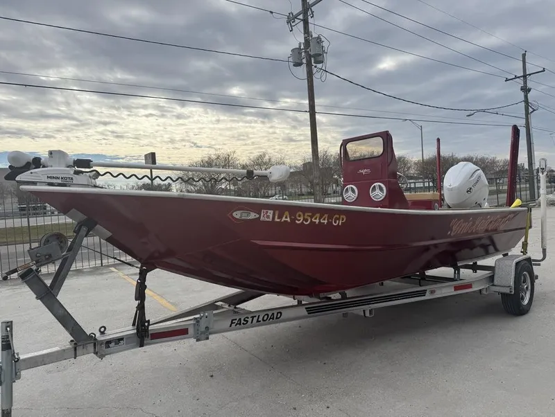 Slide: The Image of 2023 Custom Alumafab 20 CC boat on trailer, overcast sky background. - 2