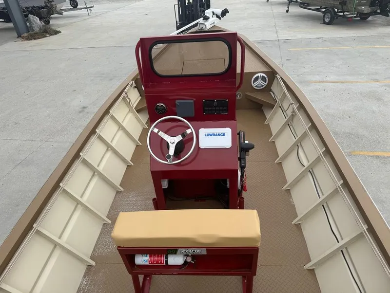 Slide: The Image of 2023 Custom Alumafab 20 CC boat interior with steering console and seating. - 3