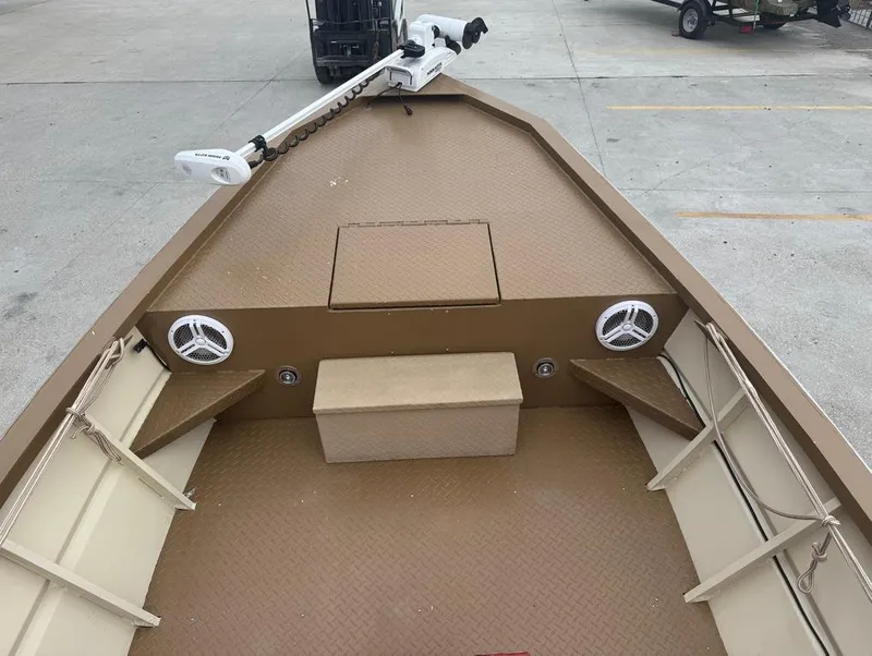 Slide: The Image of 2023 Custom Alumafab 20 CC boat interior with speakers and trolling motor. - 4