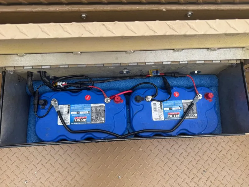 Slide: The Image of Two Optima batteries in a 2023 Custom Alumafab 20 CC boat compartment. - 5