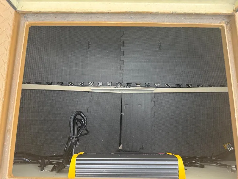 Slide: The Image of Storage compartment of 2023 Custom Alumafab 20 CC with cables and equipment. - 6