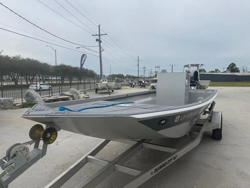 Slide: The Image of 2023 Custom Rene Gros 20 CC boat on trailer, parked outdoors. - 3