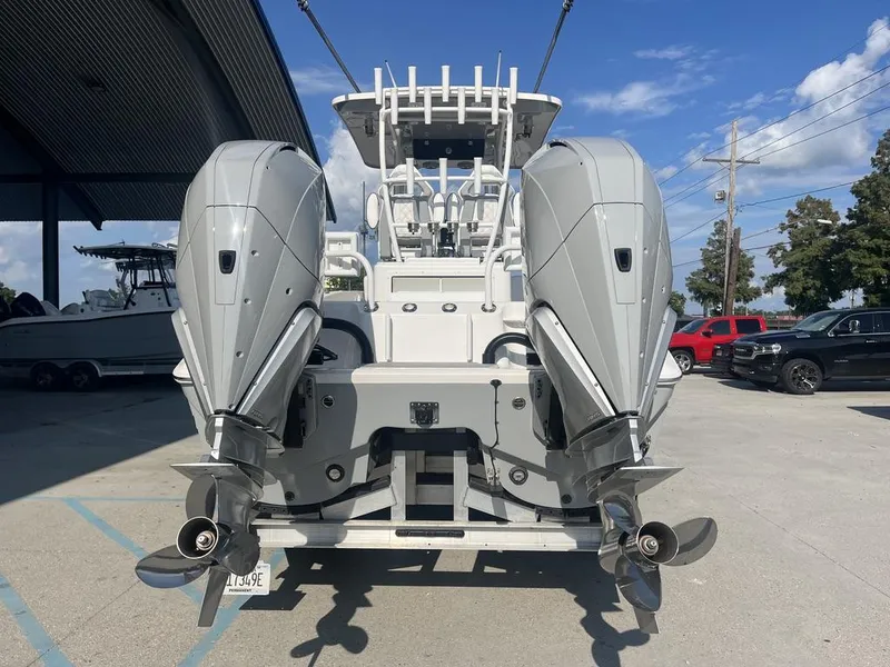 Slide: The Image of 2023 Sea Cat 262 Ultimate Edition boat interior with rod holders and steering console. - 15