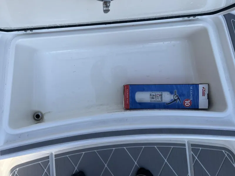 Slide: The Image of 2023 Sea Cat 262 Ultimate Edition boat with dual outboard motors on a trailer. - 19