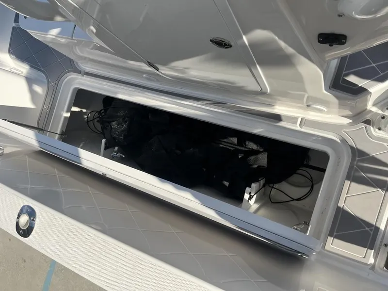 Slide: The Image of Open storage compartment in 2023 Sea Cat 262 Ultimate Edition boat. - 23