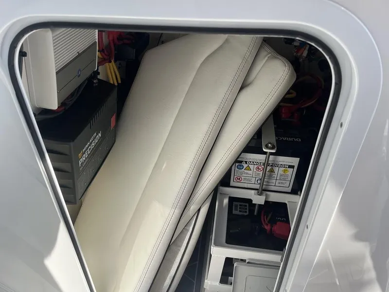 Slide: The Image of Open storage compartment on 2023 Sea Cat 262 Ultimate Edition boat. - 24