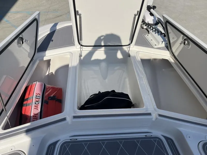 Slide: The Image of 2023 Sea Cat 262 Ultimate Edition boat on trailer under clear sky. - 8