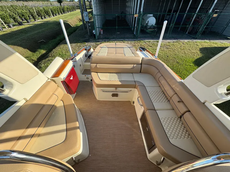 Slide: The Image of 2022 Chris-Craft Launch 25 GT interior with tan seating and spacious layout. - 11