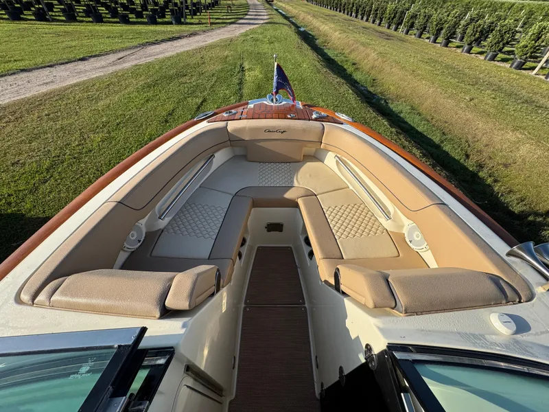 Slide: The Image of 2022 Chris-Craft Launch 25 GT boat with luxurious seating and elegant design. - 16