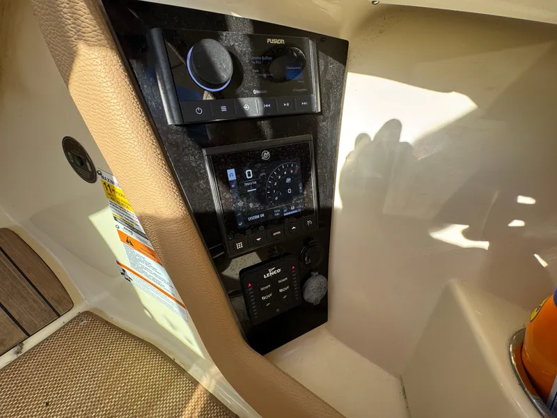 Slide: The Image of Control panel of 2022 Chris-Craft Launch 25 GT boat with navigation and audio systems. - 22