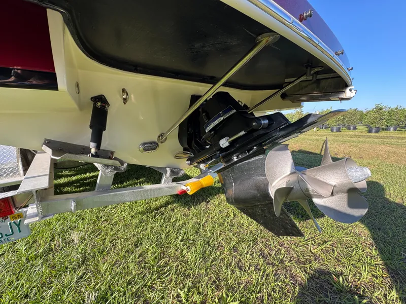 Slide: The Image of 2022 Chris-Craft Launch 25 GT boat propeller and stern on a trailer. - 5