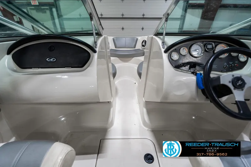 Slide: The Image of 2008 Sea Ray 185 Sport boat interior with dashboard and steering wheel. - 17