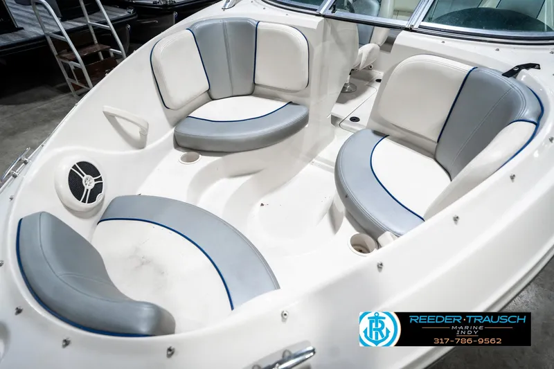 Slide: The Image of 2008 Sea Ray 185 Sport boat interior with white and gray seating. - 22