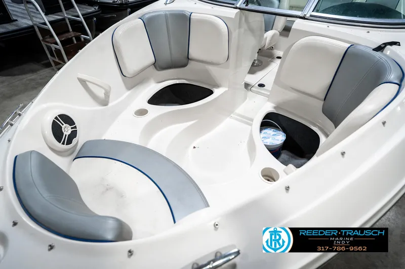 Slide: The Image of 2008 Sea Ray 185 Sport boat interior with white and gray seating. - 23