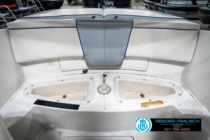 Slide: The Image of 2008 Sea Ray 185 Sport boat interior with seating and storage compartments. - 25
