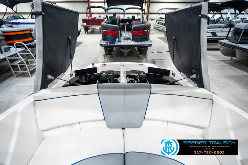 Slide: The Image of 2008 Sea Ray 185 Sport boat interior in showroom with open engine compartment. - 27
