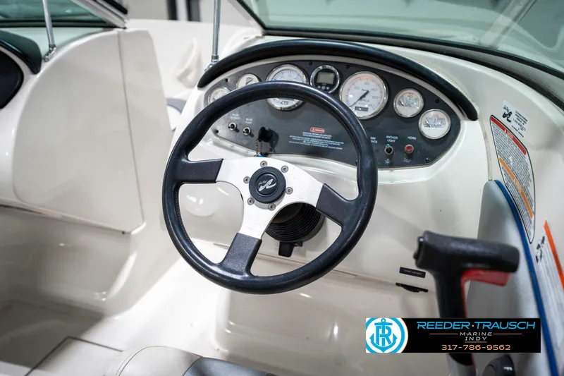 Slide: The Image of 2008 Sea Ray 185 Sport dashboard with steering wheel and instrument panel. - 28