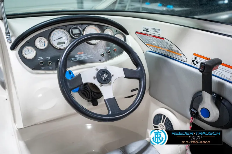 Slide: The Image of 2008 Sea Ray 185 Sport boat dashboard with steering wheel and control panel. - 29