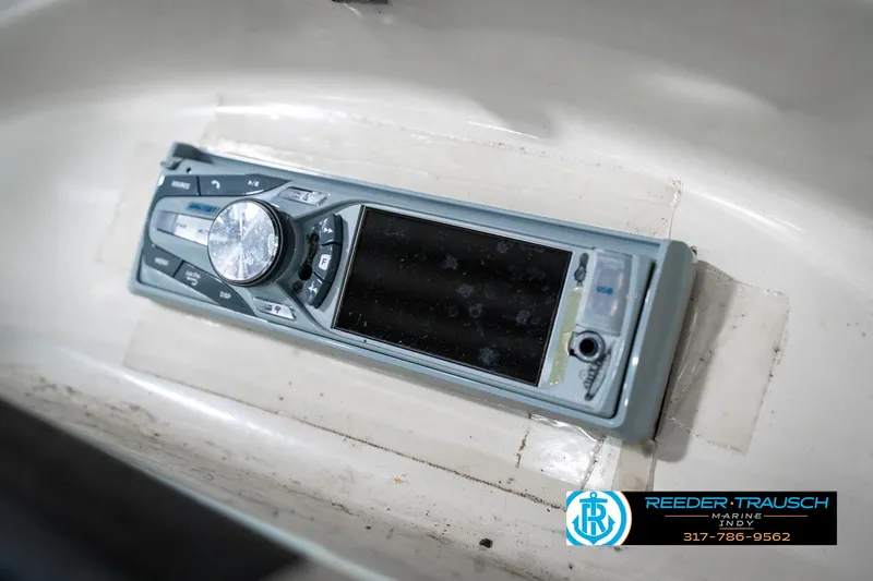 Slide: The Image of 2008 Sea Ray 185 Sport boat stereo system, featuring a sleek control panel. - 36