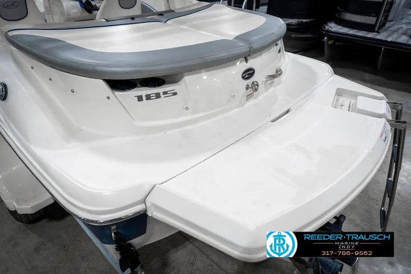 Slide: The Image of 2008 Sea Ray 185 Sport boat with swim platform, displayed indoors. - 45