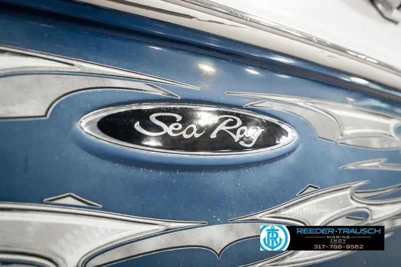 Slide: The Image of 2008 Sea Ray 185 Sport boat with custom blue and silver detailing. - 46