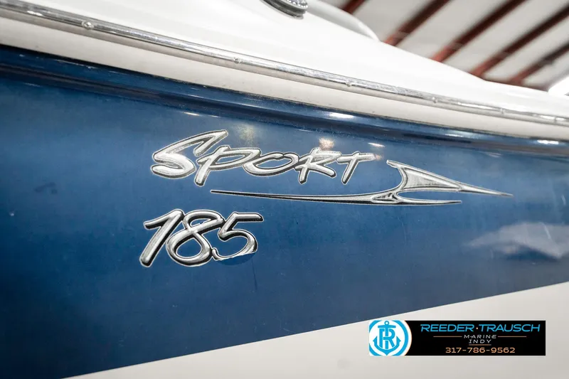 Slide: The Image of 2008 Sea Ray 185 Sport boat logo on blue hull, Reeder-Trausch Marine branding. - 47