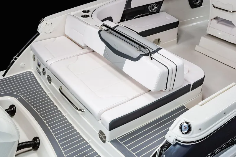 Slide: The Image of 2025 Chaparral 280 OSX boat interior with white seating and sleek design. - 10