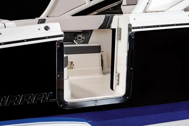 Slide: The Image of 2025 Chaparral 280 OSX boat interior with open side door, showcasing seating and speaker. - 23