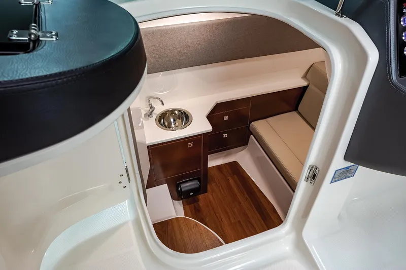 Slide: The Image of Interior cabin of 2025 Chaparral 280 OSX boat with seating and sink. - 37