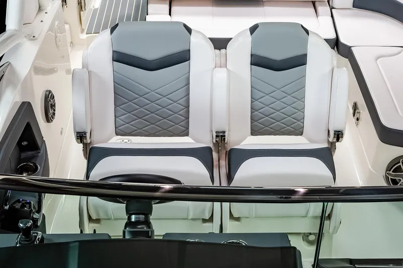 Slide: The Image of 2025 Chaparral 280 OSX boat interior with dual gray and white seats. - 39