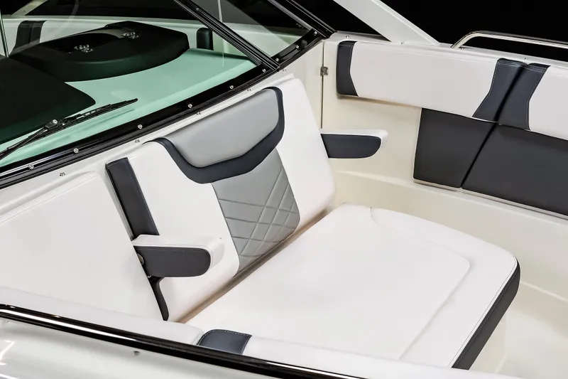 Slide: The Image of 2025 Chaparral 280 OSX boat interior with modern white and gray seating design. - 40